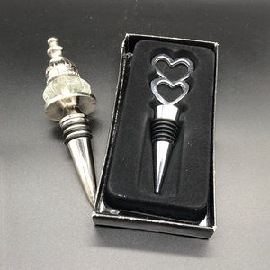 Pair Silver Tone Wine Stoppers